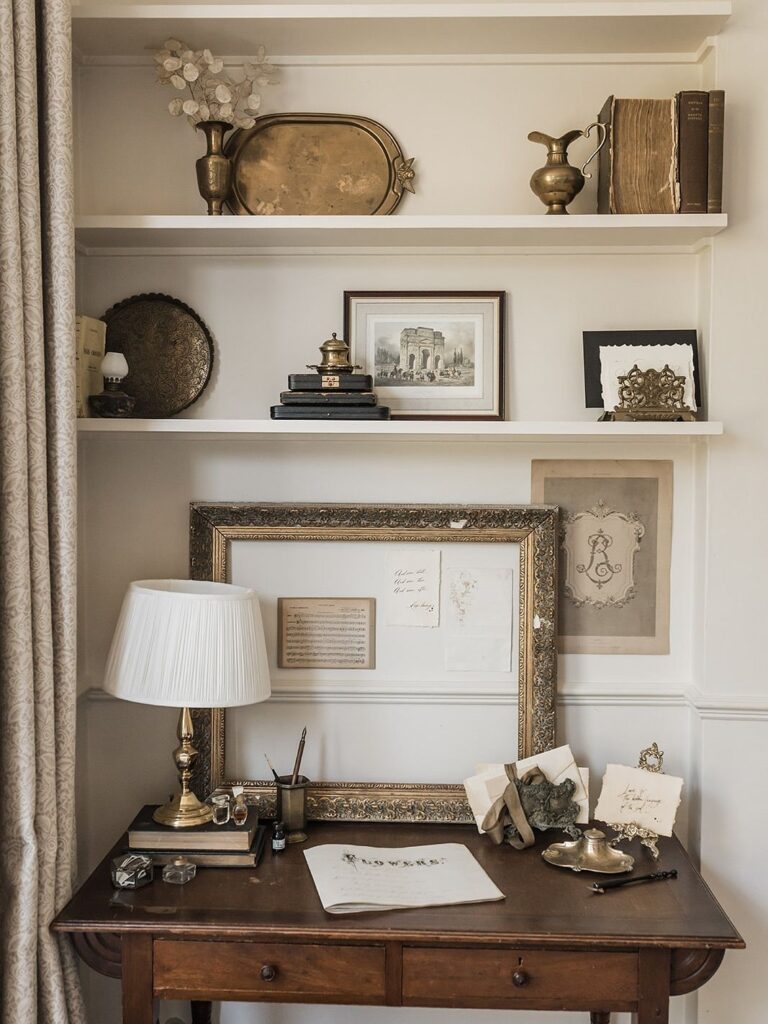 72049e1064b6e4712c9ac26b87862c0e Vintage home office setup with classic decor, antique books, and a wooden desk with elegant framed art and accessories. | Sky Rye Design Vintage home office setup with classic decor, antique books, and a wooden desk with elegant framed art and accessories.