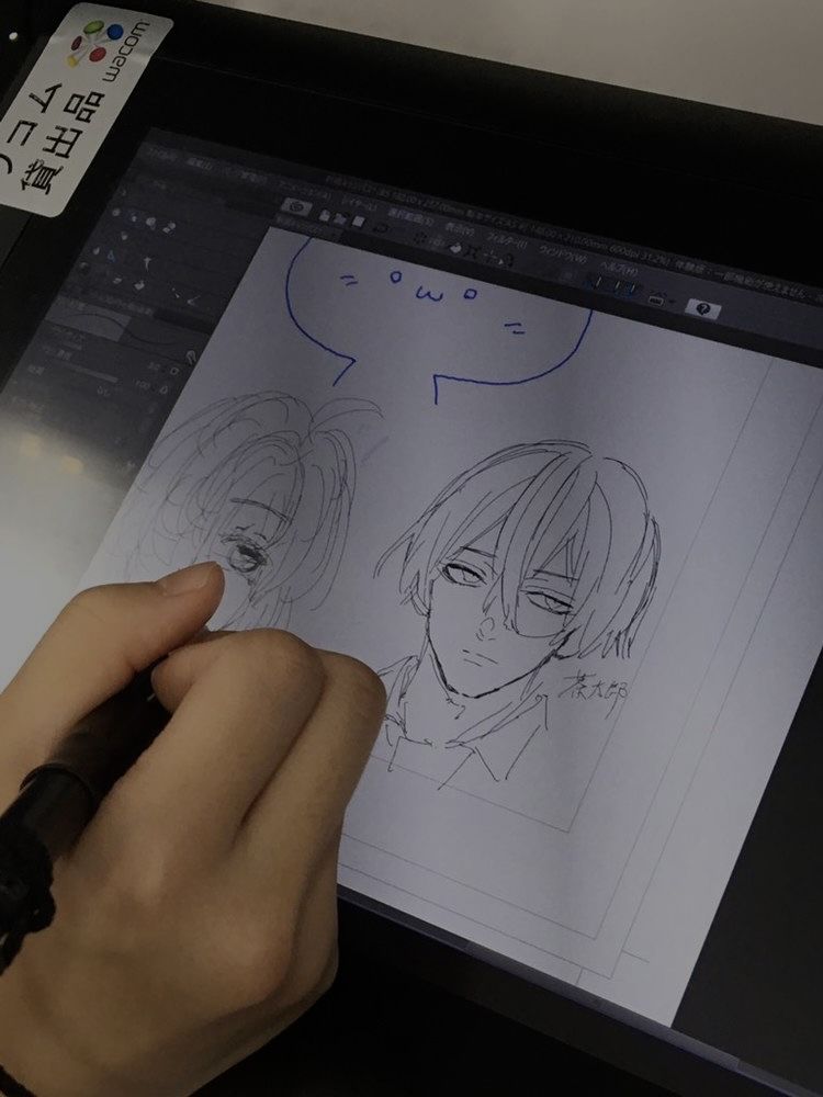 Person sketching manga characters on a digital drawing tablet, focusing on expressive facial details and dynamic hair design.