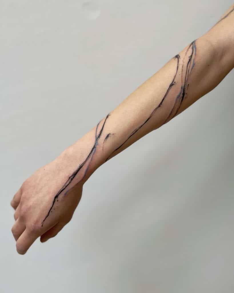 864b39e7c25e9939c470d40584fca544 Minimalist black line tattoo on a forearm, showcasing a delicate, flowing design against a pale skin background. | Sky Rye Design Minimalist black line tattoo on a forearm, showcasing a delicate, flowing design against a pale skin background.