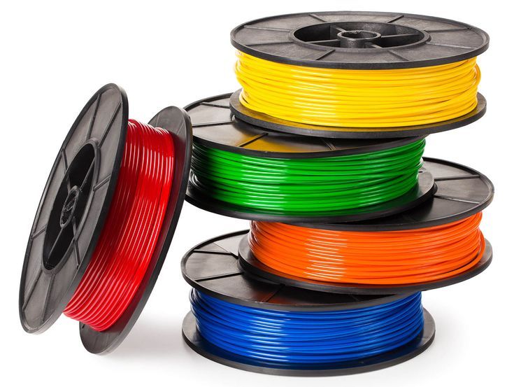8db2378dedcbf77cadfe5c1a30e18d62 Colorful spools of 3D printer filament in red, yellow, green, orange, and blue stacked on a white background. | Sky Rye Design Colorful spools of 3D printer filament in red, yellow, green, orange, and blue stacked on a white background.