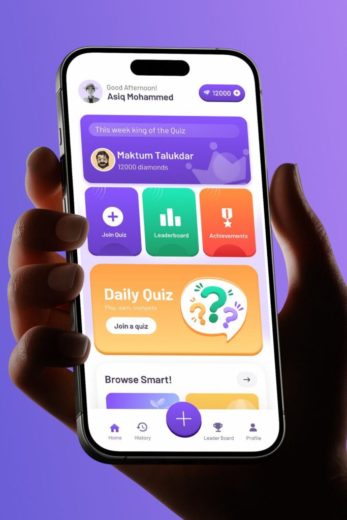 Hand holding smartphone with quiz app interface, showing leaderboard, quiz options, and achievements on a purple background.