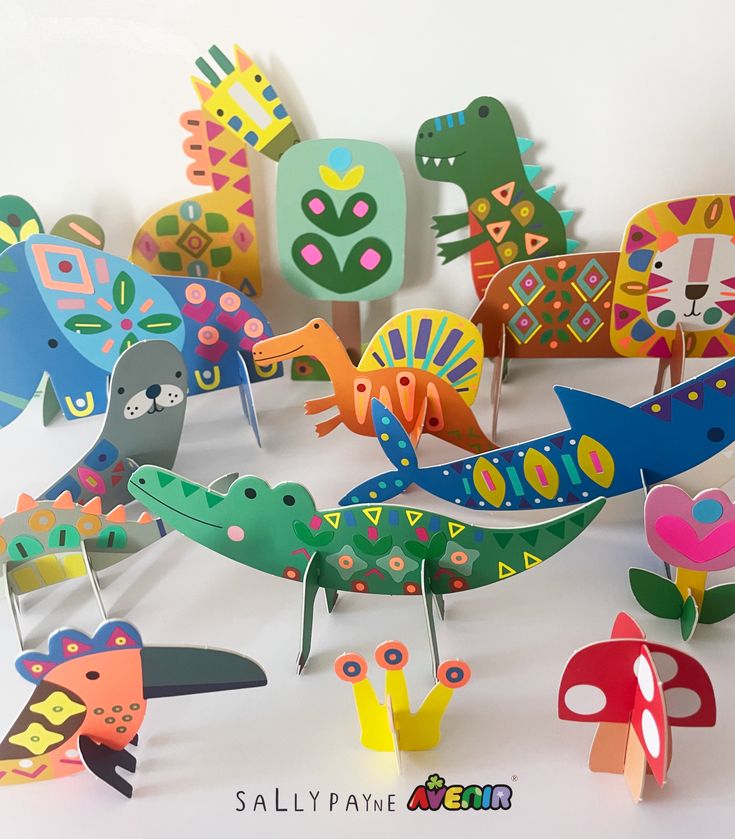 A lovely project Colorful paper animals in playful designs, featuring dinosaurs, a crocodile, and a bird, arranged on a white background. | Sky Rye Design Colorful paper animals in playful designs, featuring dinosaurs, a crocodile, and a bird, arranged on a white background.