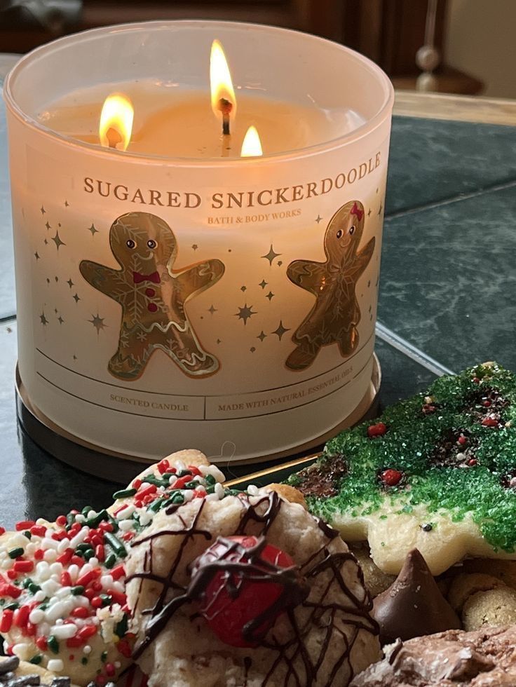 Aesthetic Snickerdoodle Candle Sugared Snickerdoodle candle lit beside festive holiday cookies, creating a cozy and warm atmosphere perfect for seasonal celebrations. | Sky Rye Design Sugared Snickerdoodle candle lit beside festive holiday cookies, creating a cozy and warm atmosphere perfect for seasonal celebrations.