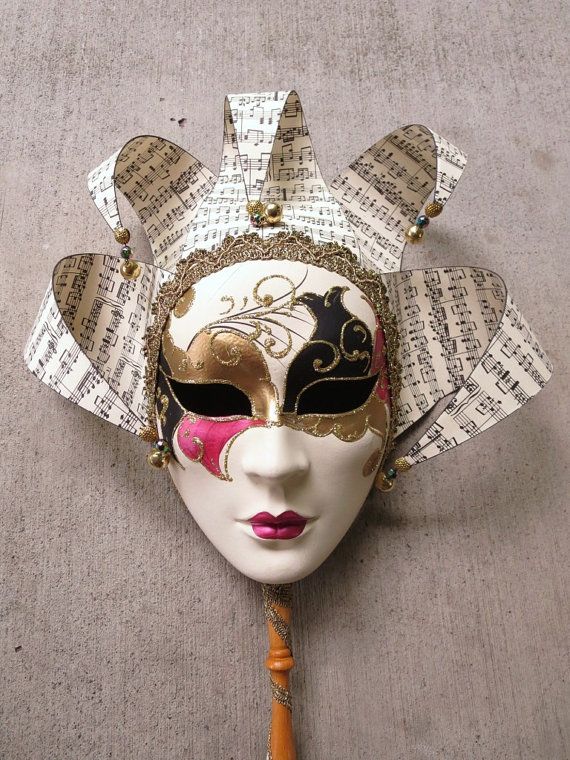 Authentic Venetian Jester Carnival Masquerade Mask by SvelteGypsy _00 Elegant Venetian mask with musical notes and ornate gold, black, and pink details against a neutral background. | Sky Rye Design Elegant Venetian mask with musical notes and ornate gold, black, and pink details against a neutral background.