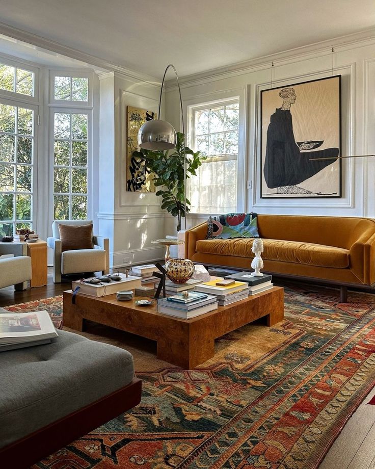 Beautiful decordesigns_ _ Seattle WA Stylish living room with patterned rug, velvet sofa, large artwork, and modern decor. Bright and inviting space. | Sky Rye Design Stylish living room with patterned rug, velvet sofa, large artwork, and modern decor. Bright and inviting space.