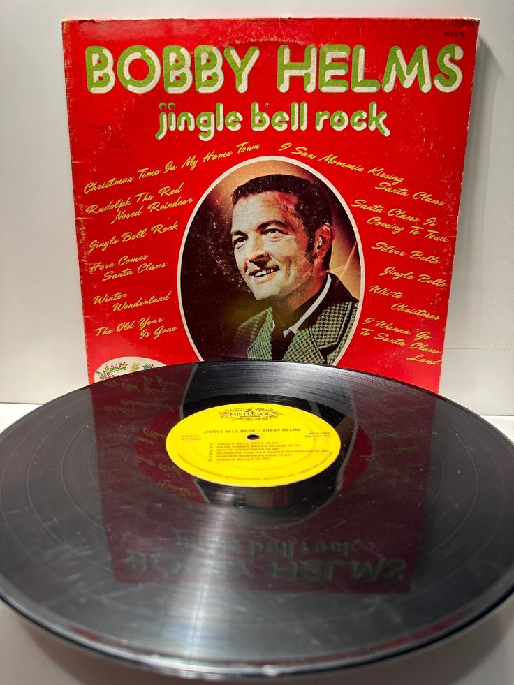 Bobby Helms Jingle bells rock Silver bells Santa Claus is coming to town 1206 record Vintage Bobby Helms Jingle Bell Rock album cover and vinyl record, red and green design, classic holiday music. | Sky Rye Design Vintage Bobby Helms Jingle Bell Rock album cover and vinyl record, red and green design, classic holiday music.
