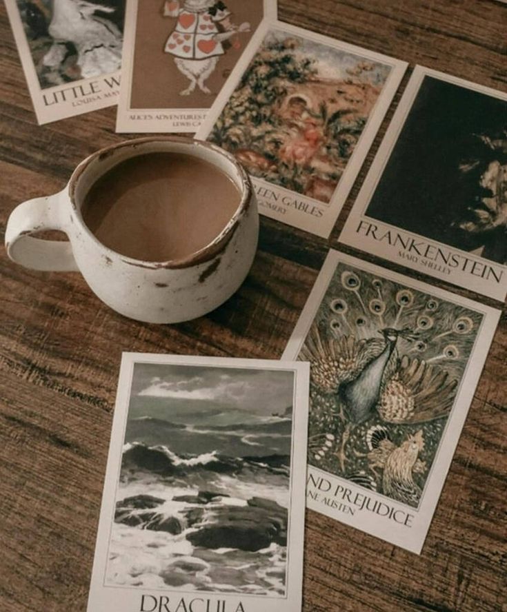 Book Cover Literary Art Postcard Set Cozy setting with a coffee mug surrounded by classic novel postcards on a wooden table, featuring titles like Dracula and Pride and Prejudice. | Sky Rye Design Cozy setting with a coffee mug surrounded by classic novel postcards on a wooden table, featuring titles like Dracula and Pride and Prejudice.