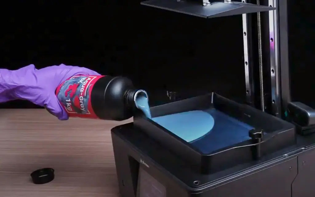 Can_You_Mix_Resins_for_3D_Printing_Here_s_What_You_Need_to_Know_1600X1000_1 Pouring blue resin into a 3D printer for detailed printing projects. | Sky Rye Design Pouring blue resin into a 3D printer for detailed printing projects.