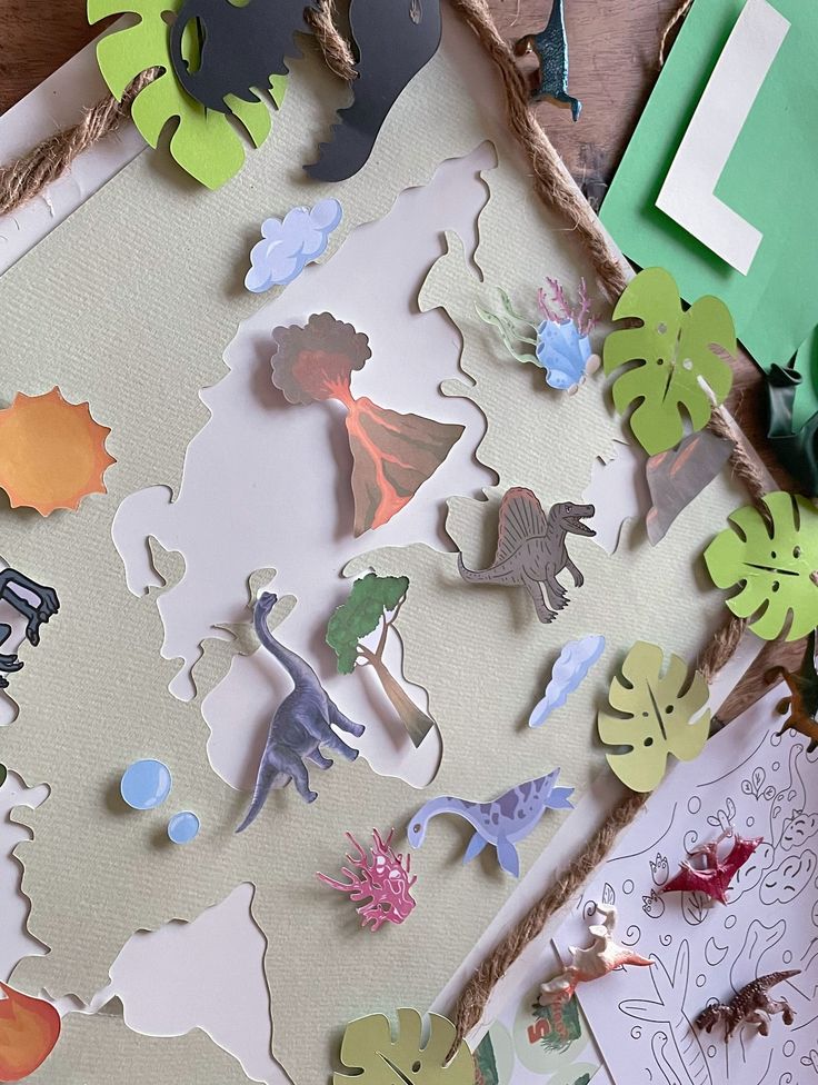 Chez LAtelier Citron ça bouge 🥳_Hier cétait mon premier événement 🦕_À défaut davoir un local pour le moment je propose des ateliers créatifs à domicile pour lévénement de votre choix___Hier cétait l Colorful dinosaur-themed paper craft with volcano and plants, perfect for creative prehistoric educational projects for kids. | Sky Rye Design Colorful dinosaur-themed paper craft with volcano and plants, perfect for creative prehistoric educational projects for kids.