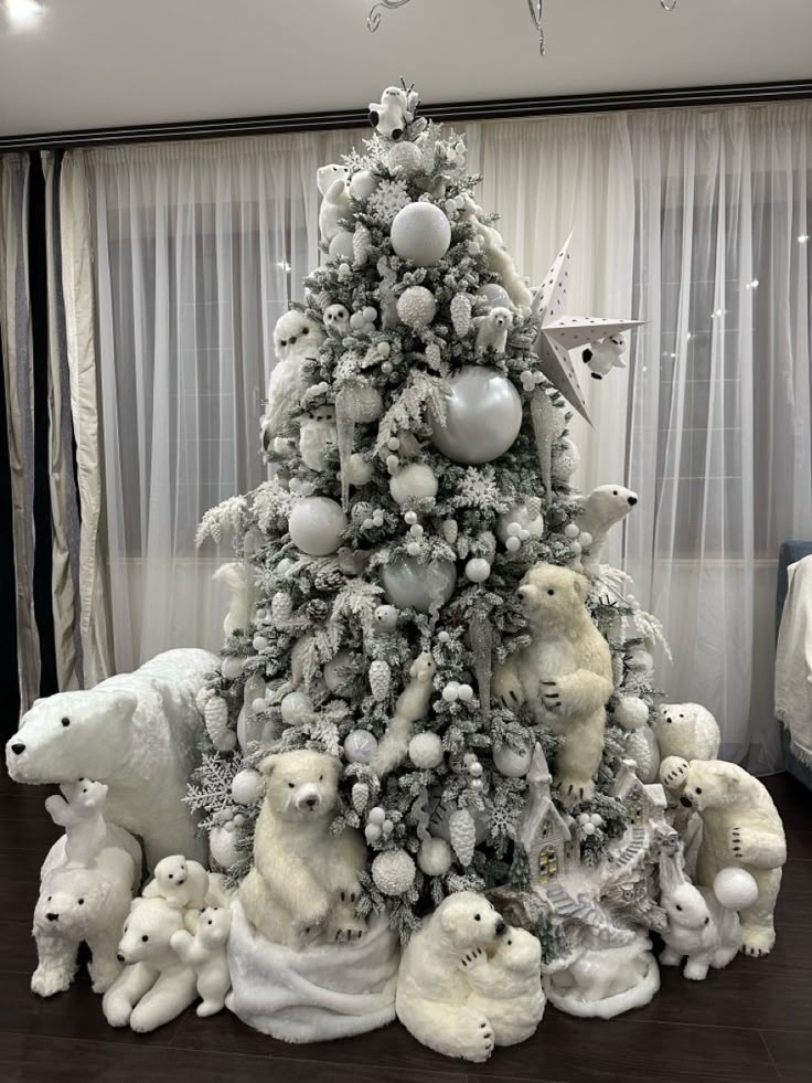 Elegant Christmas tree adorned with polar bear decorations and white ornaments, creating a cozy winter wonderland in a living room.