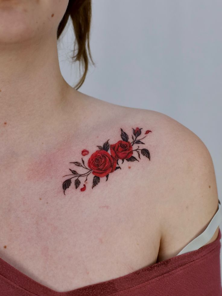 Red rose tattoo on shoulder with delicate detailing and black leaves, adding elegance and style. Perfect floral body art inspiration. realistic rose tattoos