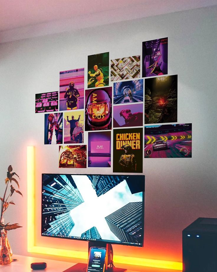 Gaming setup with vibrant wall art, neon lights, and a modern desktop displaying a cityscape for an immersive experience.