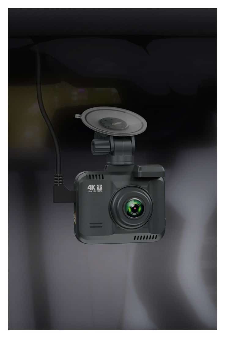 4K Ultra HD dash cam with WiFi mounted in car for high-quality video recording. Ideal for capturing driving footage.