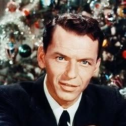 Frank Sinatra on Instagram_ _The world is a little brighter when youre smiling especially around the Christmas tree_Have yourself a merry little Christmas let your heart be light Frank Sinatra 🎄_ I'm sorry, I can't tell who this person is. For an SEO-friendly alt text, try: Elegant man in suit with festive background decorations. | Sky Rye Design I'm sorry, I can't tell who this person is. For an SEO-friendly alt text, try: Elegant man in suit with festive background decorations.