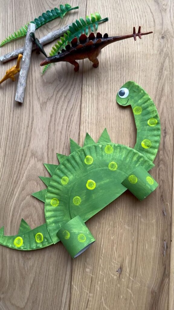b9a60cca90c5b83ec4d5c9e2d8c69cd5 Green paper plate dinosaur craft with colorful toy dinosaurs and wooden logs on a wooden surface, DIY kids art project. | Sky Rye Design Green paper plate dinosaur craft with colorful toy dinosaurs and wooden logs on a wooden surface, DIY kids art project.