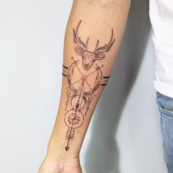 Geometric tattoo Geometric deer tattoo on forearm, featuring intricate lines and circular designs for a modern and artistic look. | Sky Rye Design Geometric deer tattoo on forearm, featuring intricate lines and circular designs for a modern and artistic look.
