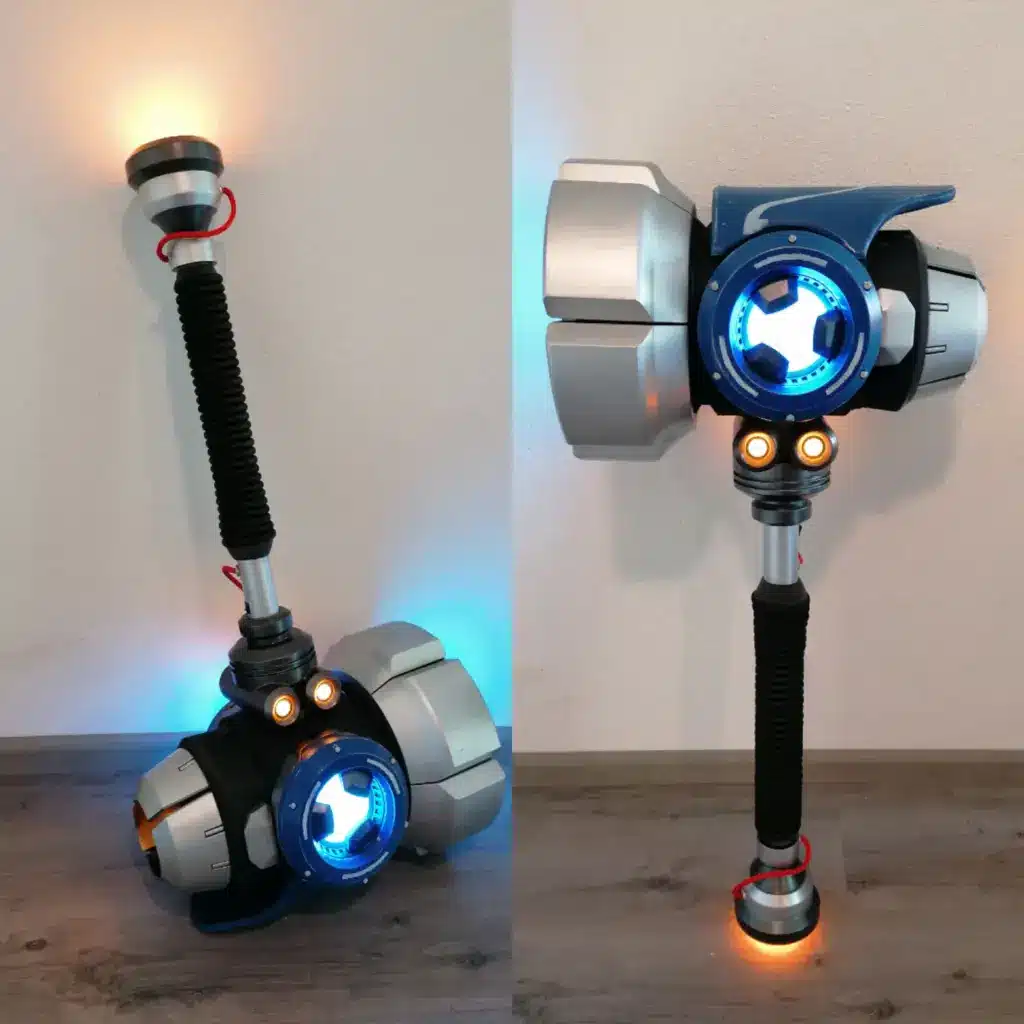 IMG_20200715_193255 Futuristic LED hammer design with blue and orange lights on a wooden floor, showcasing a sci-fi aesthetic. | Sky Rye Design Futuristic LED hammer design with blue and orange lights on a wooden floor, showcasing a sci-fi aesthetic.