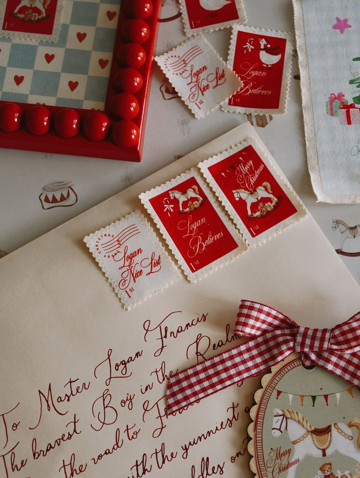 Christmas-themed envelope with red stamps and decorative items, including a checkered bow and festive illustrations.