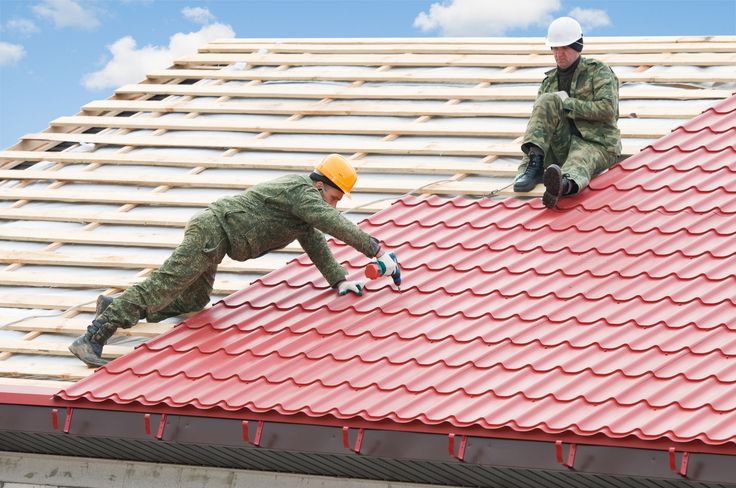 It is true that you can spray apply a coat or two of waterproofing on any existing flat roof no matter what the membrane looks like_ Two workers in safety gear install red metal roofing panels under a blue sky. | Sky Rye Design Two workers in safety gear install red metal roofing panels under a blue sky.