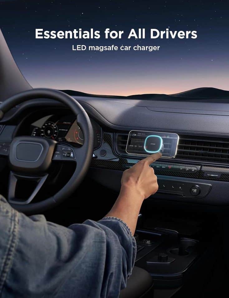 Person using LED MagSafe car charger on dashboard at dusk.