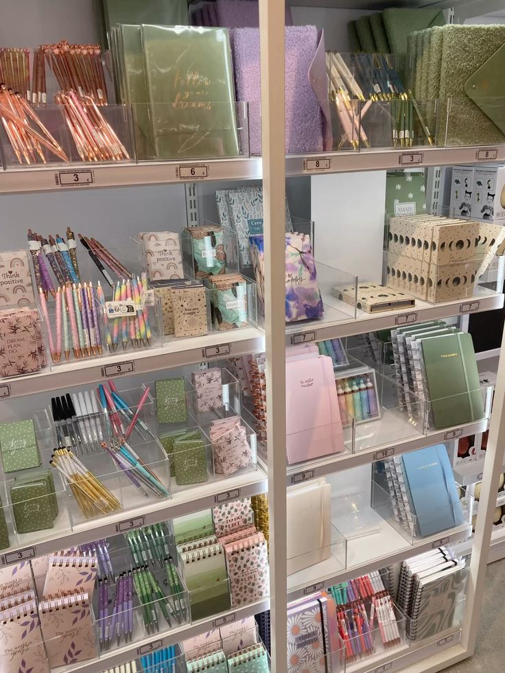 Journal aesthetic Colorful stationery display with notebooks, pens, and planners on shelves. Ideal for school, office, or creative projects. | Sky Rye Design Colorful stationery display with notebooks, pens, and planners on shelves. Ideal for school, office, or creative projects.