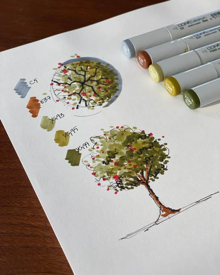 Tree sketch with markers on paper, featuring color samples and Copic markers beside it. Artistic drawing process displayed.