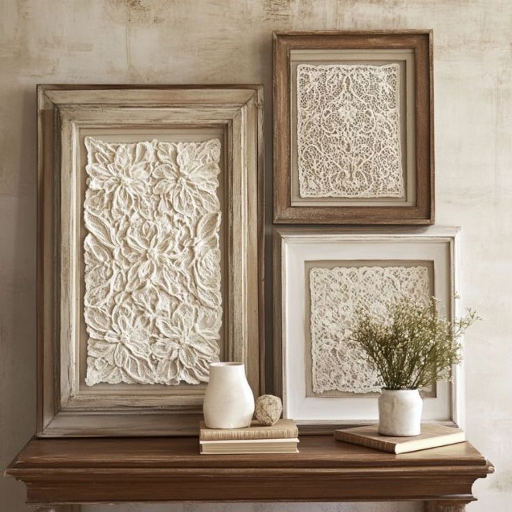 Framed lace wall art displayed on a wooden shelf with decorative books and vases, adding rustic charm to a cozy interior space.