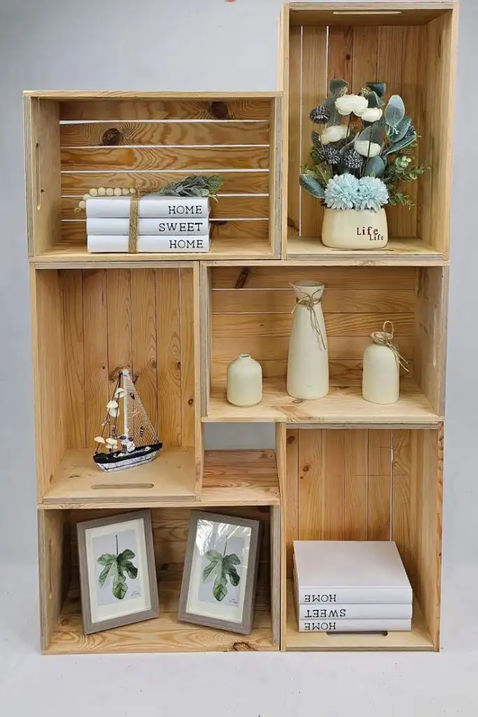 Large Wooden Crate with Handles Multipurpose Storage Display Box Farmhouse Style Solid Rustic Wooden Crate45cmx30cmx18cm Wooden shelves with decorative items: ceramic vases, framed leaf prints, a model ship, and stacked books with Home Sweet Home. | Sky Rye Design Wooden shelves with decorative items: ceramic vases, framed leaf prints, a model ship, and stacked books with Home Sweet Home.