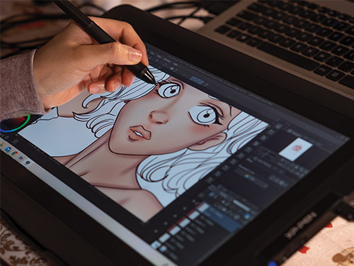 Digital artist uses a stylus on a drawing tablet to create an illustration of a woman with white hair and expressive features.