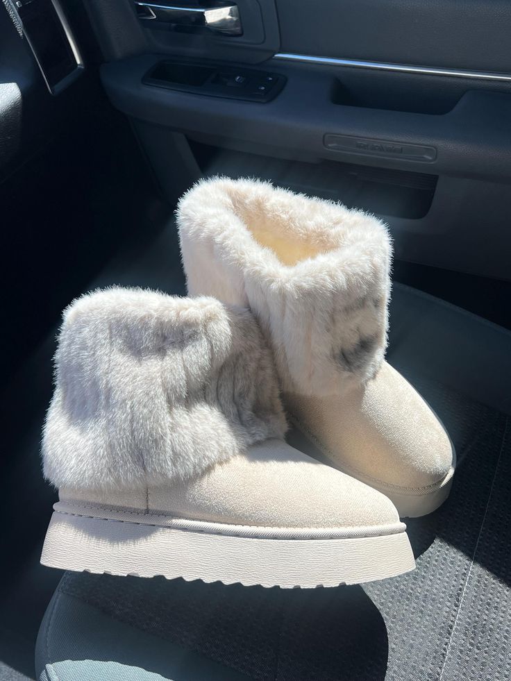 Cozy beige fur-lined winter boots on car seat, capturing fashion and warmth with plush textures for cold weather comfort.