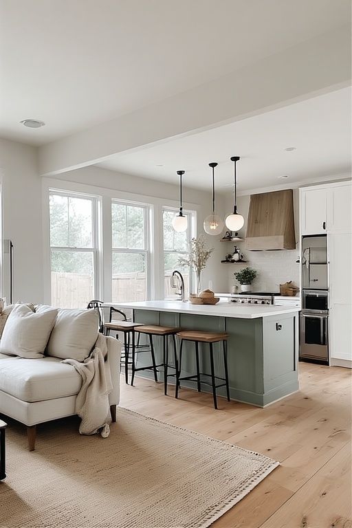 Modern Small Open Kitchen Living Room Ideas for Smart Homes Modern kitchen with island, barstools, and pendant lights. Bright and airy open layout with hardwood flooring. | Sky Rye Design Modern kitchen with island, barstools, and pendant lights. Bright and airy open layout with hardwood flooring.