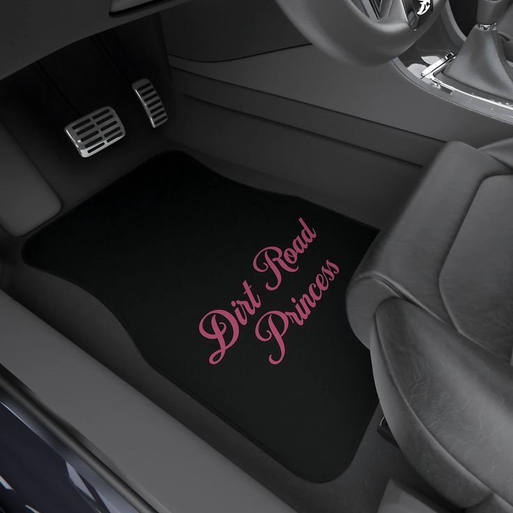 Car floor mat with pink Dirt Road Princess text in vehicle interior, highlighting style and personality.