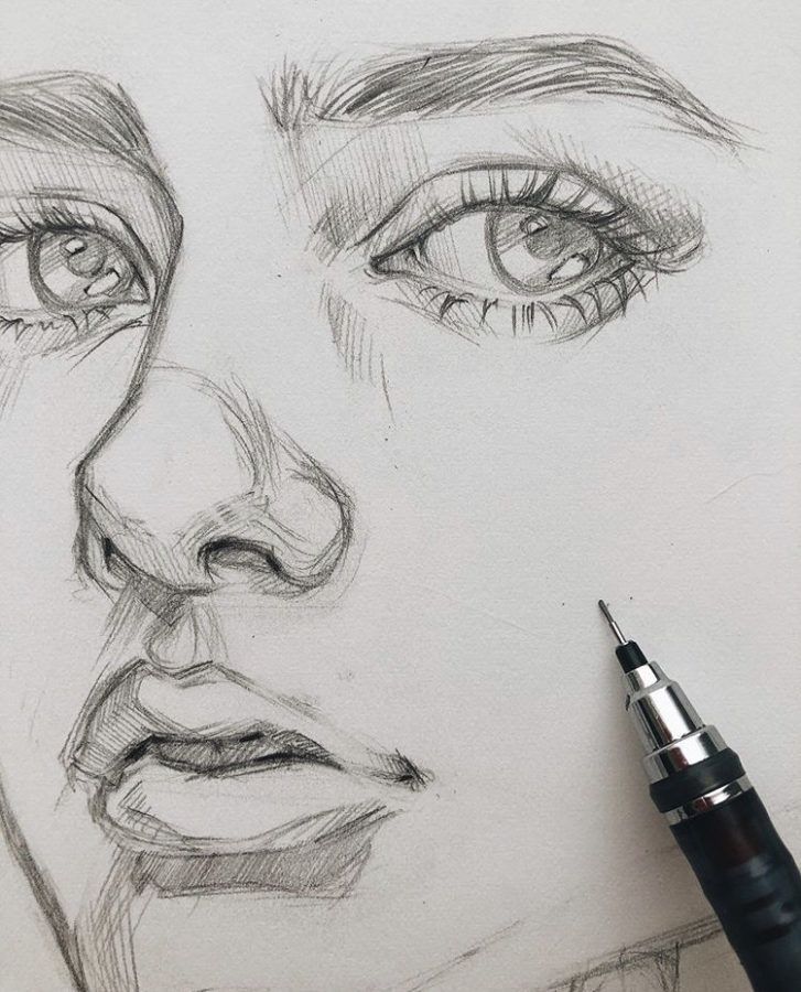 Portrait Drawing Guides and Inspiration Bein Kemen Close-up of a pencil sketch of a face with detailed eyes, nose, and lips alongside a mechanical pencil on paper. | Sky Rye Design Close-up of a pencil sketch of a face with detailed eyes, nose, and lips alongside a mechanical pencil on paper.