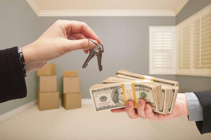 Quick Cash Offer for your Sacramento House Exchanging house keys for stacks of cash in an empty room, symbolizing real estate transaction or home sale. | Sky Rye Design Exchanging house keys for stacks of cash in an empty room, symbolizing real estate transaction or home sale.