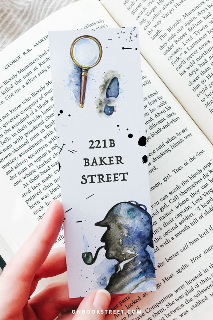Sherlock Holmes Bookmark 221B Baker Street Printable _ Etsy Bookmark inspired by Sherlock Holmes with magnifying glass, footprint, and silhouette on an open book. Text reads 221B Baker Street. | Sky Rye Design Bookmark inspired by Sherlock Holmes with magnifying glass, footprint, and silhouette on an open book. Text reads 221B Baker Street.