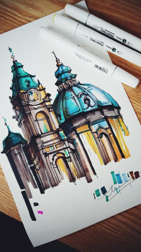 Architectural sketch with vibrant markers showing a detailed, colorful drawing of a historic building on paper.