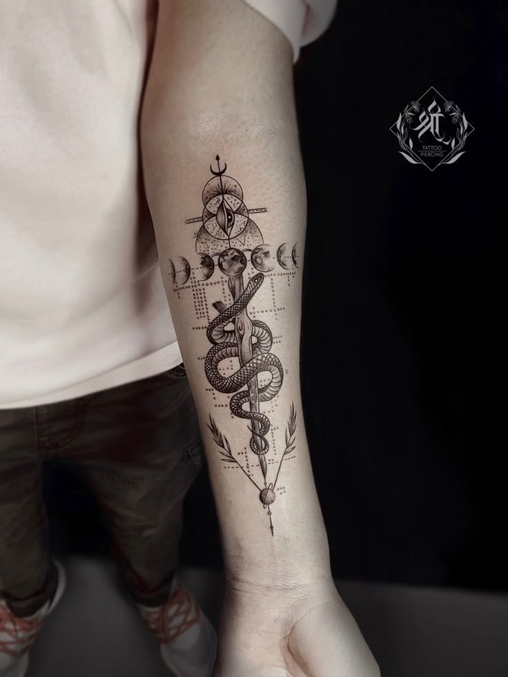 Snake with moon tattoo __ snake tattoo __ moon tattoo Geometric snake and moon phase tattoo on forearm, blending intricate linework and symbolism. | Sky Rye Design Geometric snake and moon phase tattoo on forearm, blending intricate linework and symbolism.