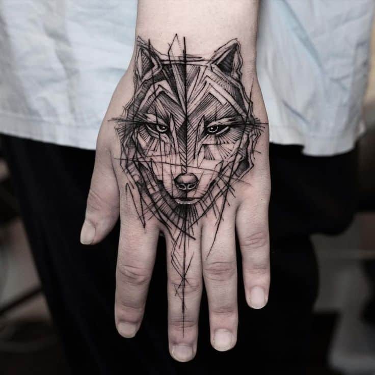 Tattoo by © Bk_tattooer Geometric wolf hand tattoo with intricate linework, showcasing detailed artistry and bold design on the skin. | Sky Rye Design Geometric wolf hand tattoo with intricate linework, showcasing detailed artistry and bold design on the skin.