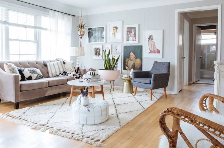 This Gorgeous Velvet Loveseat Looks 3x the Price but Its More Than 25 Today Bright living room with modern decor, stylish furniture, wall art, and a cozy vibe. A dog relaxes on a white pouf near the coffee table. | Sky Rye Design Bright living room with modern decor, stylish furniture, wall art, and a cozy vibe. A dog relaxes on a white pouf near the coffee table.