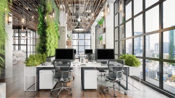 Top Mistakes to Avoid When Buying Office Furniture Online Modern office with green walls and large windows, featuring ergonomic chairs and desks with computers, overlooking a cityscape. | Sky Rye Design Modern office with green walls and large windows, featuring ergonomic chairs and desks with computers, overlooking a cityscape.