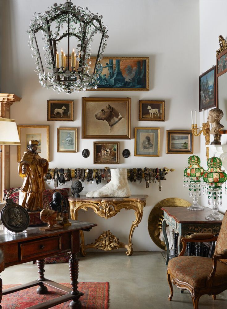 Two Eclectic Homes in Trophy Club Are a Master Class in Mixing Periods and Styles Eclectic antique room with ornate chandelier, paintings, sculptures, and vintage furniture for a classic decor style. | Sky Rye Design Eclectic antique room with ornate chandelier, paintings, sculptures, and vintage furniture for a classic decor style.