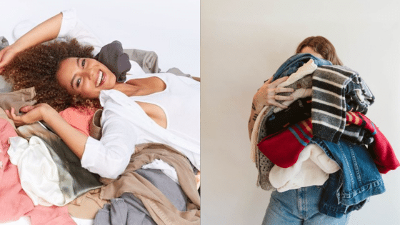 Two women enjoying piles of mixed clothing; one lying down smiling, the other holds a bundle of colorful clothes in front of her.