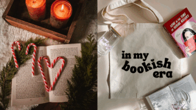 Cozy book setup with candy canes, candles, and a tote bag reading in my bookish era, alongside a book and glass cup. Perfect for book lovers.