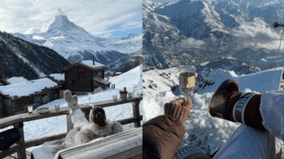 Enjoying a winter retreat with stunning views of snow-capped mountains, cozy cabins, and a glass of wine on a sunny deck.