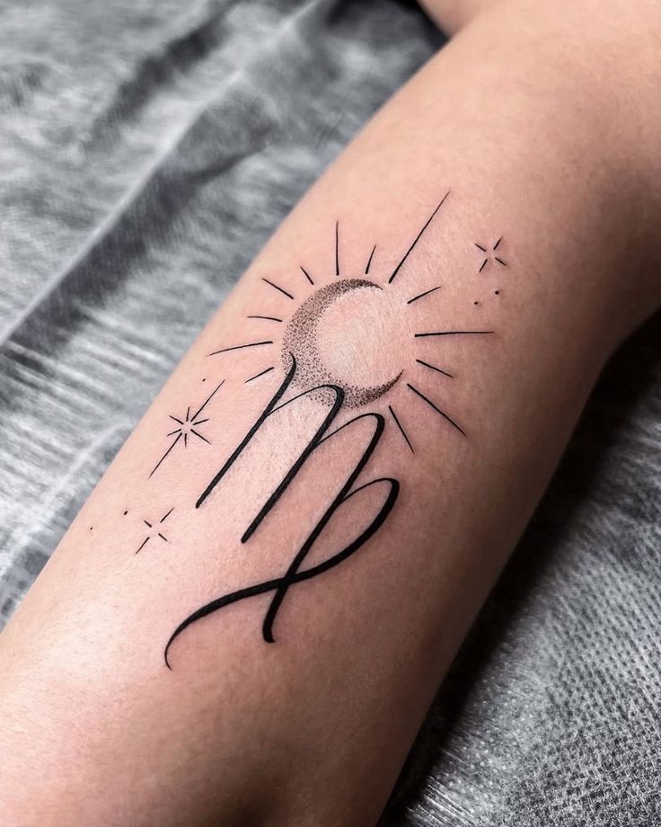 Minimalist Virgo tattoo design featuring a crescent moon and stars on skin, blending astrology and art for personalized body ink.