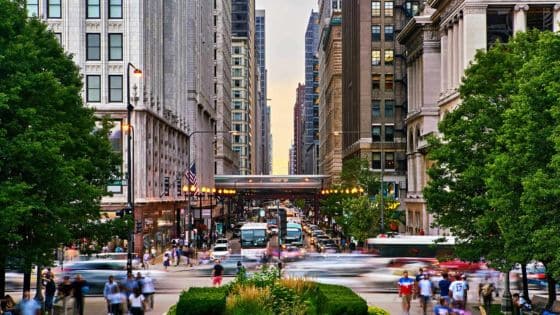 Why Rapid Urban Growth Creates New Plumbing Challenges for Homeowners Bustling city street lined with tall buildings and green trees, capturing vibrant urban life and architectural scenery at dusk. | Sky Rye Design Bustling city street lined with tall buildings and green trees, capturing vibrant urban life and architectural scenery at dusk.