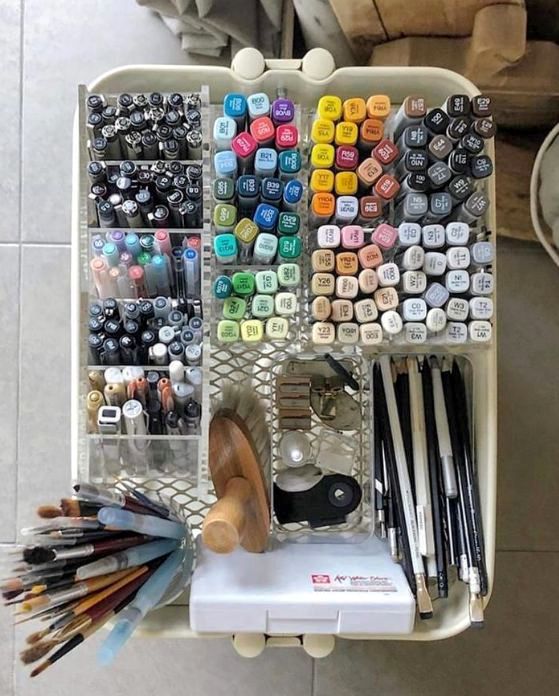 abaetb Organized art supplies with markers, pens, pencils, and brushes in a tray for creative projects. | Sky Rye Design Organized art supplies with markers, pens, pencils, and brushes in a tray for creative projects.