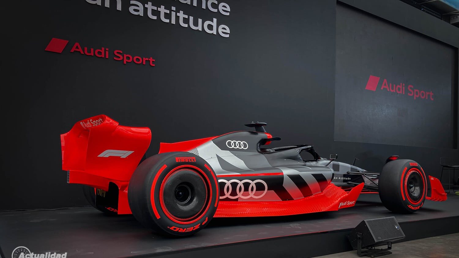 Audi Sport Formula 1 concept car showcased in sleek black and red livery, highlighting advanced design and performance technology.