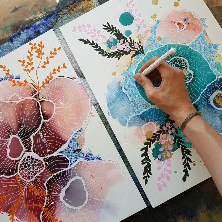 c1bcb190-0316-45d9-a737-d4630e497910 Artist's hand drawing colorful abstract floral patterns on paper with a pen, showcasing creative and intricate design elements. | Sky Rye Design Artist's hand drawing colorful abstract floral patterns on paper with a pen, showcasing creative and intricate design elements.
