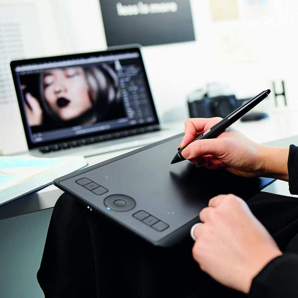 c4de453e11df0c1e8a9a6449196ebf57 Digital artist using a pen tablet for photo editing on a laptop. Creative workspace setup with sleek design. | Sky Rye Design Digital artist using a pen tablet for photo editing on a laptop. Creative workspace setup with sleek design.